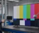 Engineer preparing a controlled 4 mm tempered glass TV impact test
